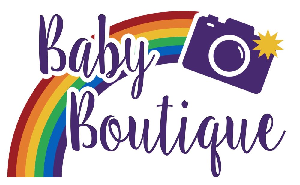 Brand New Logo! Baby Boutique Manchester is the North West's Most Colourful photography studio! A rainbow leads to a purple camera with a yellow flash. The words 'Baby Boutique' are written in purple.
